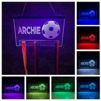 Personalised football medal hanger featuring a custom name engraved at the top, illuminated by vibrant LED lights in various colors, displaying several football medals hanging below