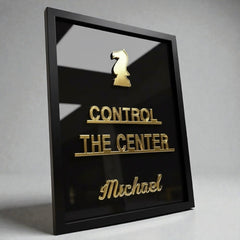 Close-up of gold mirror acrylic chess quote lettering on black personalised frame