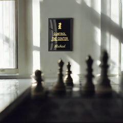 Personalised chess quote frame displayed on a desk with gold acrylic lettering